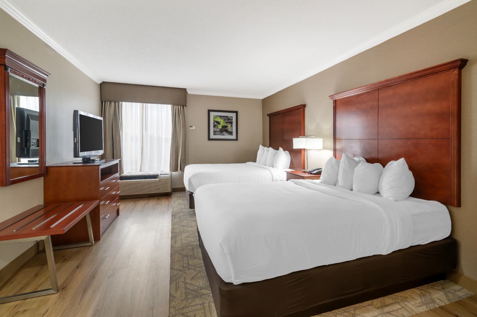 Two Queen guest room with two queen beds at Syracuse Grand hotel in Liverpool, NY
